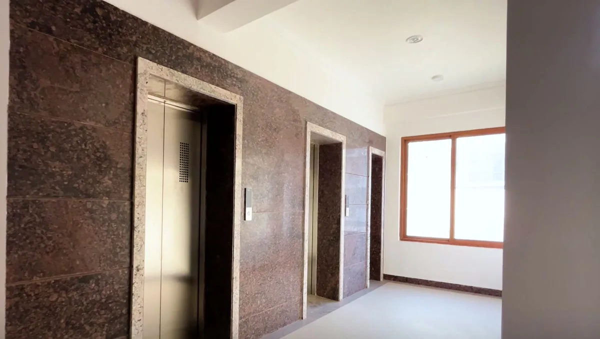 The stone-clad lift lobby