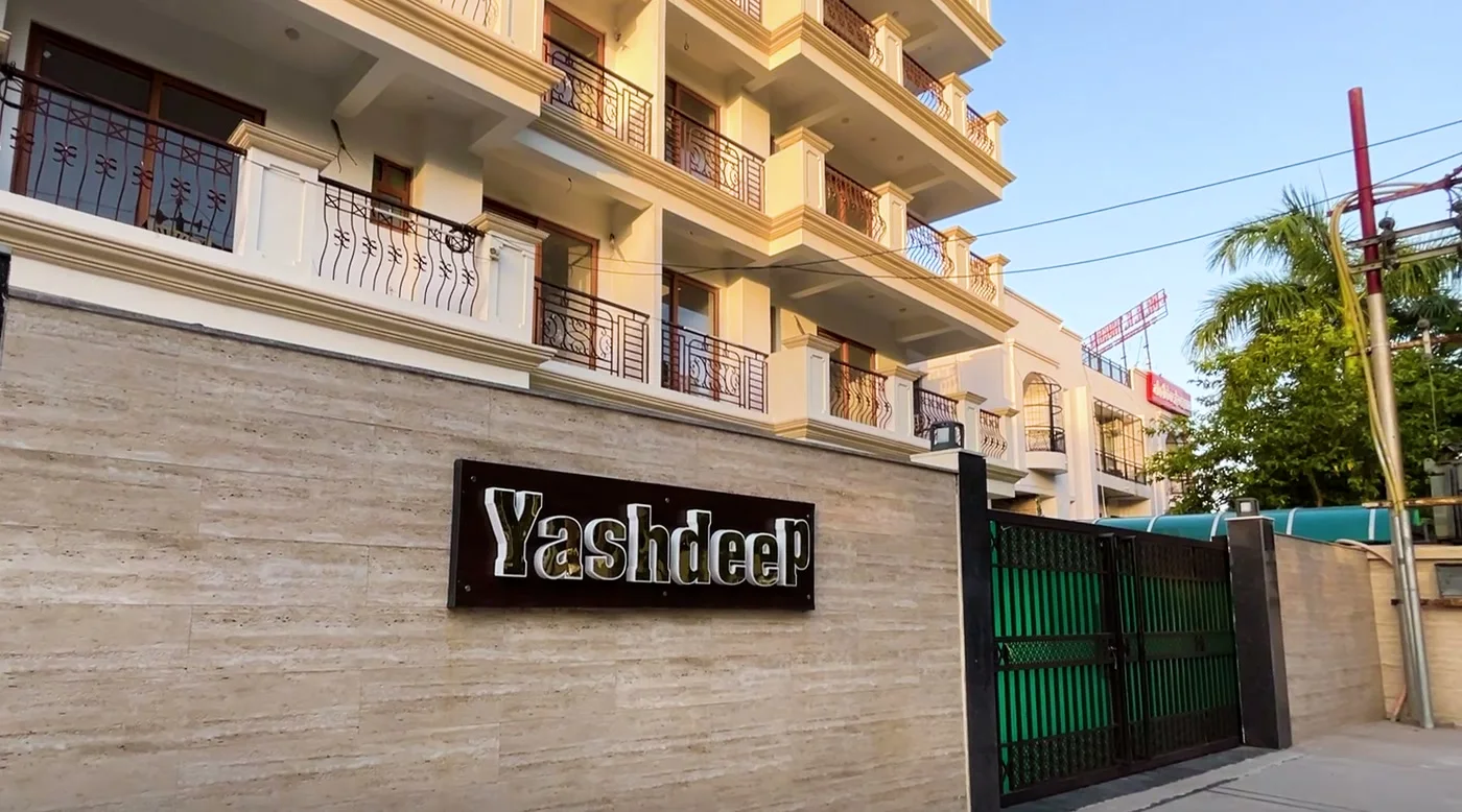 The Yashdeep nameplate beside the secured entry gate